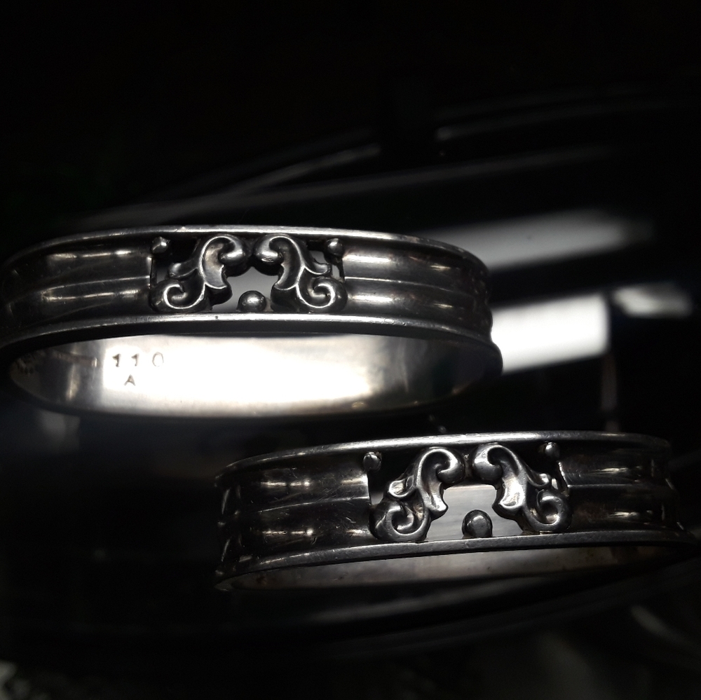 Pair of George Jensen, Denmark, sterling silver, napkin rings, 110 A, 110 B